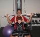 Kyle shows Daddy how to do the lat pulldown.