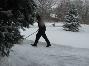 Heather uses a snow scoop 2